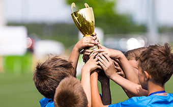 Kids Holding Trophy